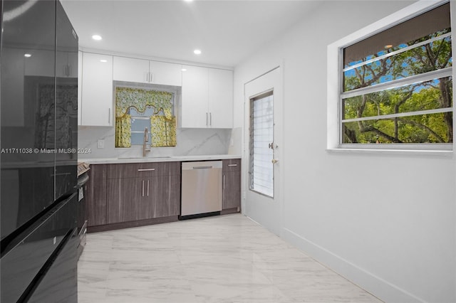 kitchen with backsplash, dark brown cabinetry, sink, dishwasher, and white cabinetry