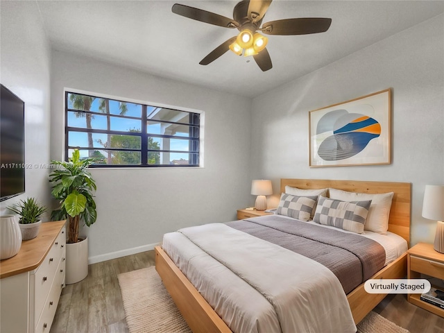 bedroom featuring ceiling fan and light wood-type flooring