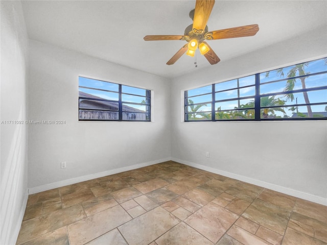 spare room with ceiling fan