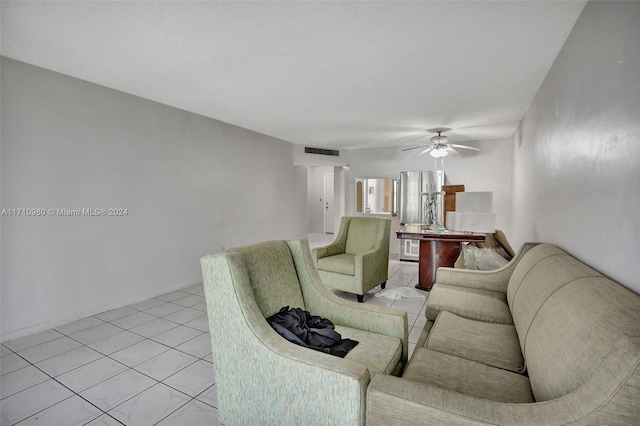 living room featuring ceiling fan and light tile patterned floors