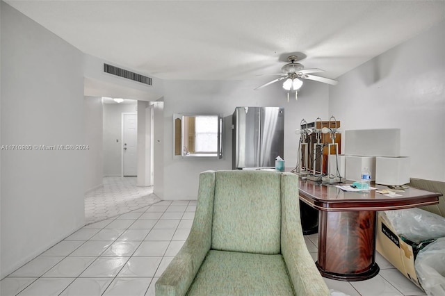 tiled dining area featuring ceiling fan