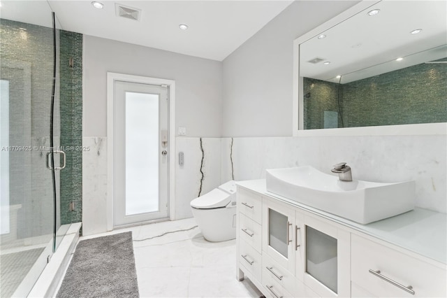 bathroom featuring vanity, tile walls, an enclosed shower, and toilet