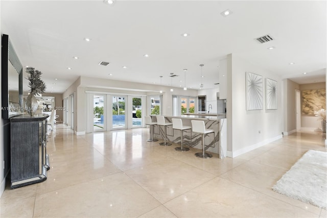 living room featuring french doors and sink