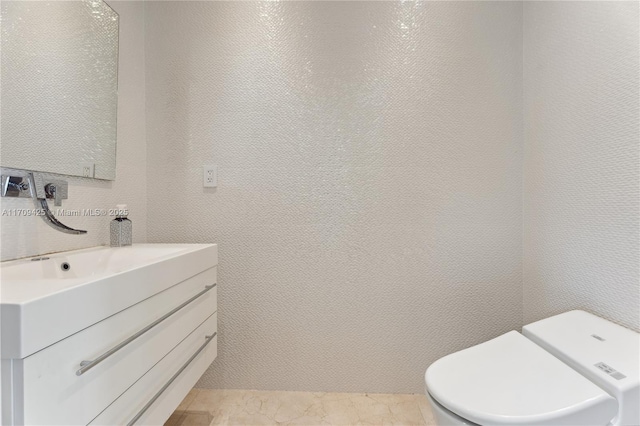 bathroom with vanity and toilet