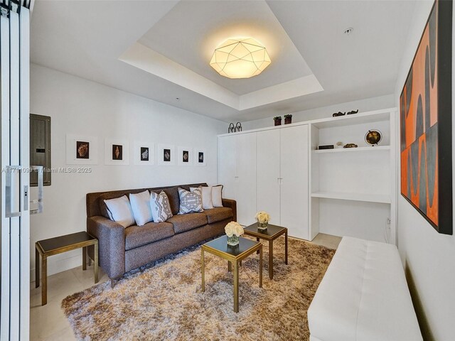 17301 Biscayne Blvd Unit 2008, North Miami Beach, FL 33160 - tiled living room featuring built in shelves and a raised ceiling