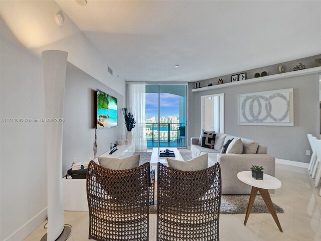 17301 Biscayne Blvd Unit 2008, North Miami Beach, FL 33160 - dining room featuring baseboards and floor to ceiling windows