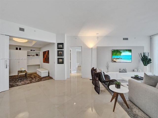 living room with light tile patterned flooring