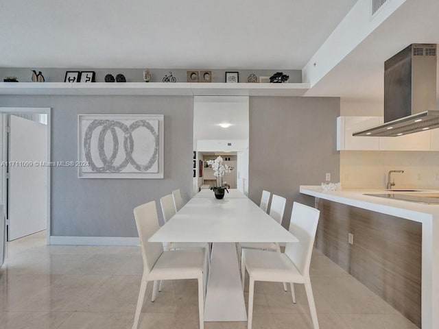 dining room featuring sink