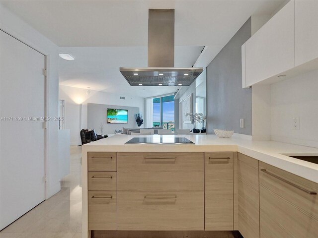 kitchen with black appliances, sink, tasteful backsplash, island range hood, and kitchen peninsula