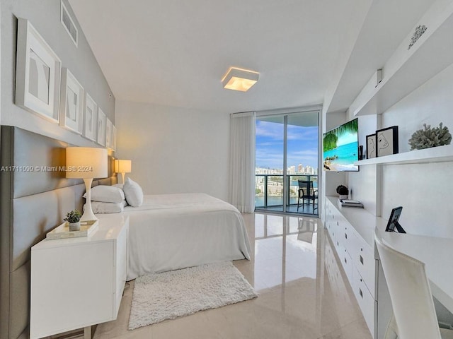 bedroom with access to outside and expansive windows