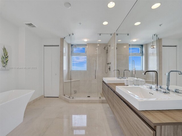 17301 Biscayne Blvd Unit 2008, North Miami Beach, FL 33160 - bathroom with a freestanding tub, a sink, a shower stall, visible vents, and double vanity
