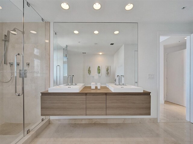 17301 Biscayne Blvd Unit 2008, North Miami Beach, FL 33160 - full bathroom featuring double vanity, a sink, recessed lighting, and a shower stall
