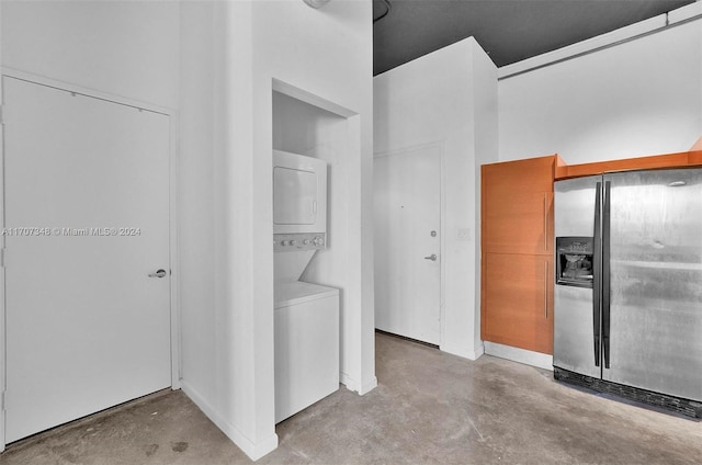 washroom featuring stacked washer and dryer