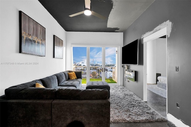 living room featuring concrete floors and ceiling fan