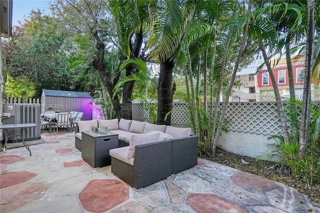 view of patio with central AC unit, an outdoor hangout area, and a storage unit