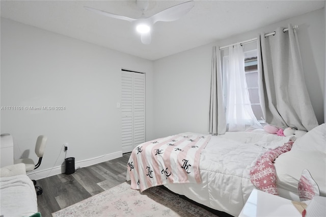 bedroom with hardwood / wood-style flooring, a closet, and ceiling fan