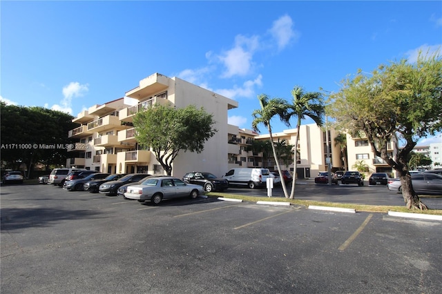 view of property featuring uncovered parking