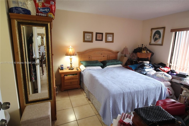 bedroom with light tile patterned floors