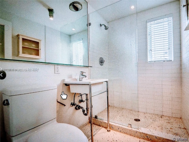 bathroom with a tile shower