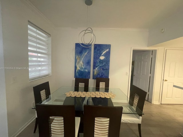 dining area featuring crown molding