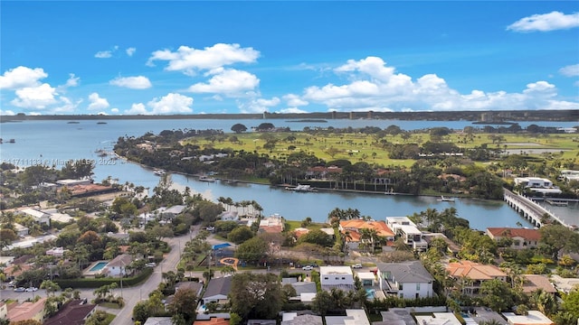 drone / aerial view featuring a residential view and a water view