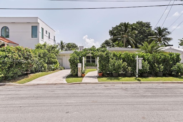 view of front of property with driveway and stucco siding