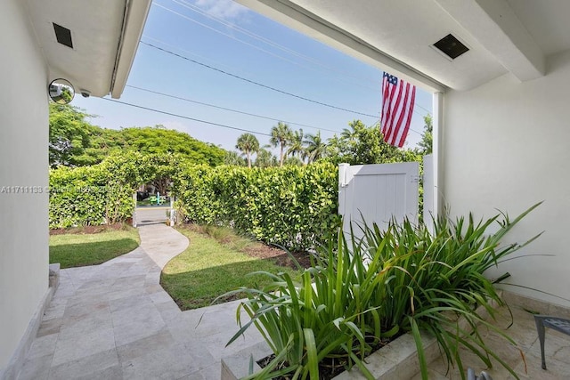 view of yard featuring a patio area, a gate, and fence