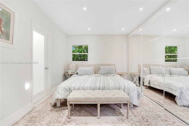 bedroom with recessed lighting and baseboards