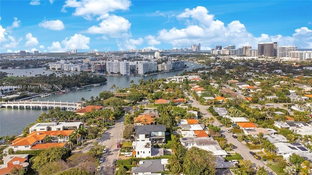 drone / aerial view featuring a water view and a city view