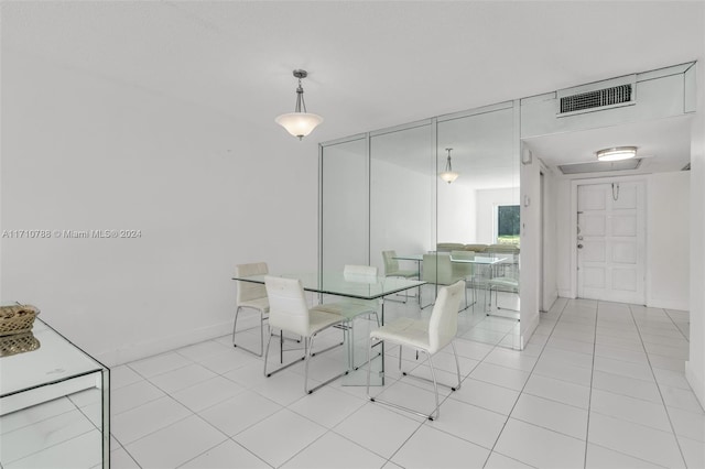 dining area with light tile patterned floors