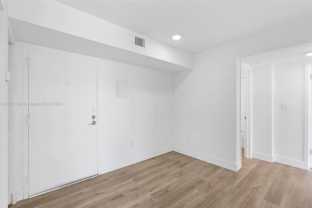 spare room featuring light hardwood / wood-style flooring