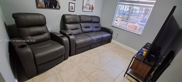 cinema room featuring light tile patterned floors