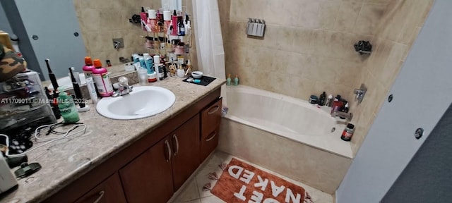 bathroom with tile patterned floors, vanity, and shower / tub combo