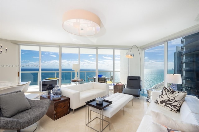 living room featuring floor to ceiling windows, a water view, and light tile patterned flooring