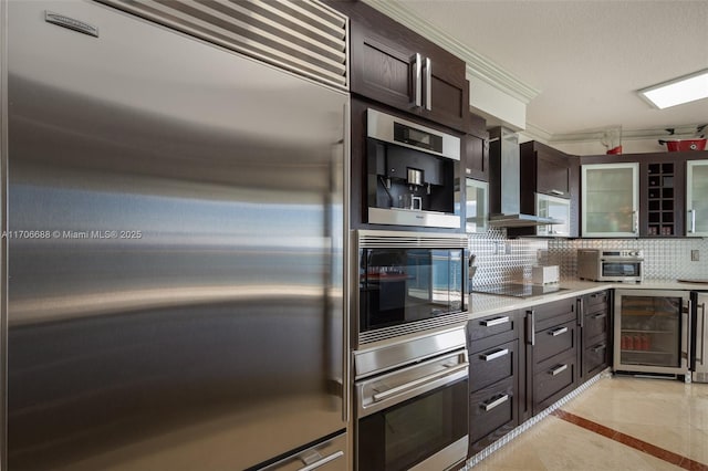 kitchen with backsplash, black appliances, wine cooler, light tile patterned floors, and dark brown cabinetry