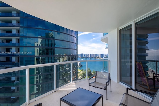 balcony featuring a water view