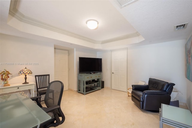 office area featuring a raised ceiling and ornamental molding