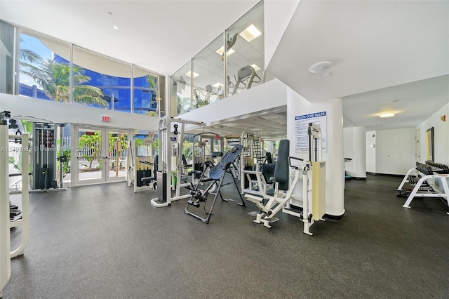 workout area with a high ceiling and french doors