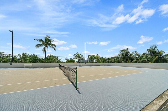 view of sport court featuring basketball hoop