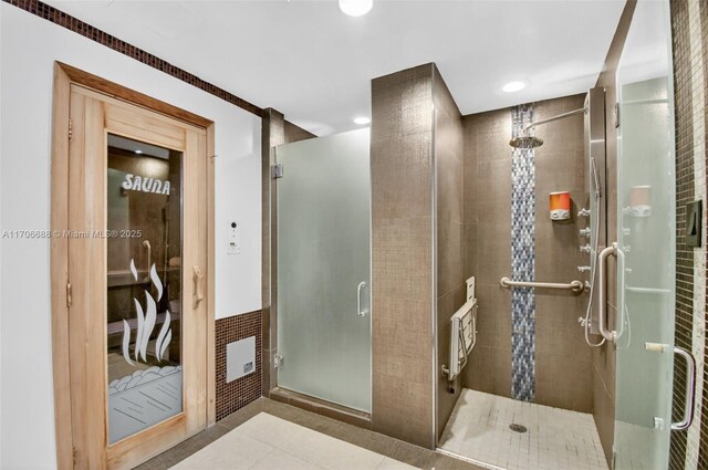 18671 Collins Ave Unit 3101, Sunny Isles Beach, FL 33160 - bathroom featuring a shower stall, tile patterned flooring, and recessed lighting