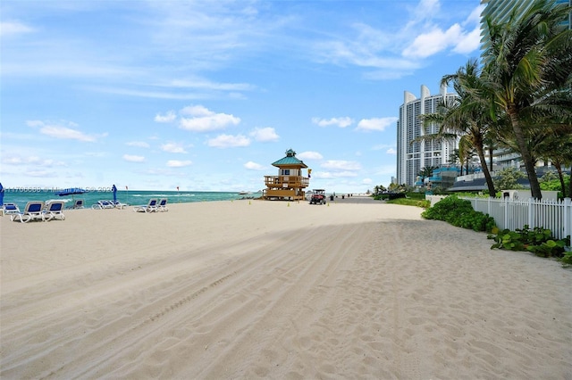 property view of water featuring a beach view