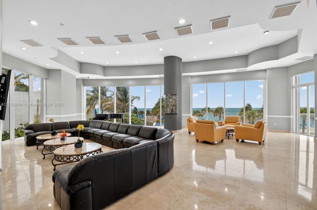 18671 Collins Ave Unit 3101, Sunny Isles Beach, FL 33160 - living area featuring healthy amount of natural light, light marble finish floors, and a towering ceiling