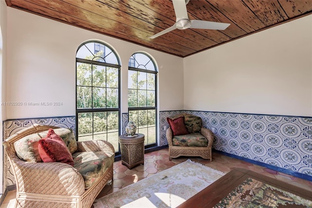 sitting room featuring ceiling fan and wooden ceiling