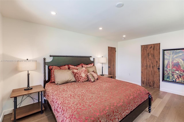 bedroom featuring wood-type flooring