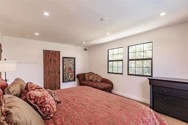 bedroom with light hardwood / wood-style flooring