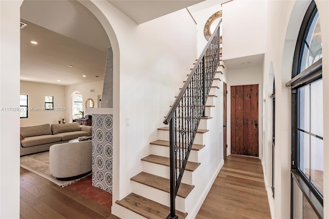 staircase featuring hardwood / wood-style flooring