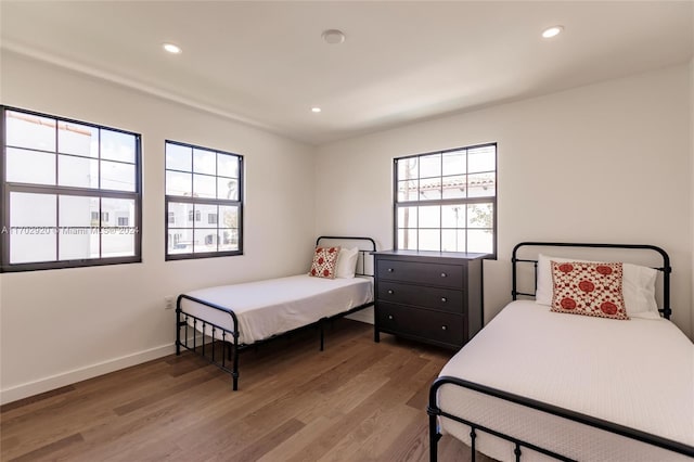 bedroom with hardwood / wood-style flooring