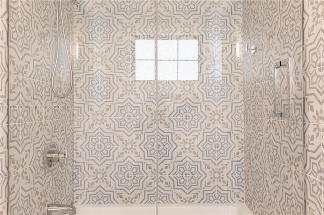 bathroom with tiled shower