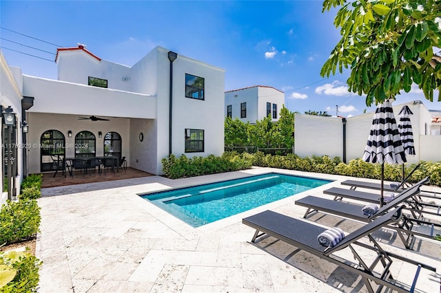 view of pool featuring a patio and ceiling fan