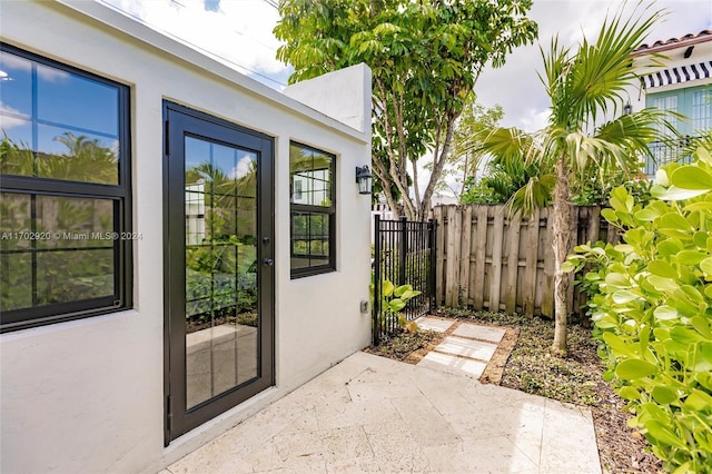 doorway to property featuring a patio area